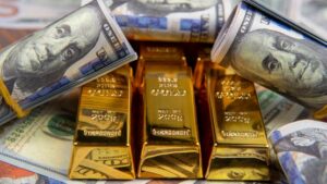 ضغط الدولار يهبط بأسعار الذهب​
